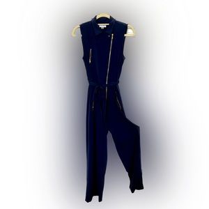 Calvin Klein women’s sleeveless navy jumpsuit with golden accessories. Size 6